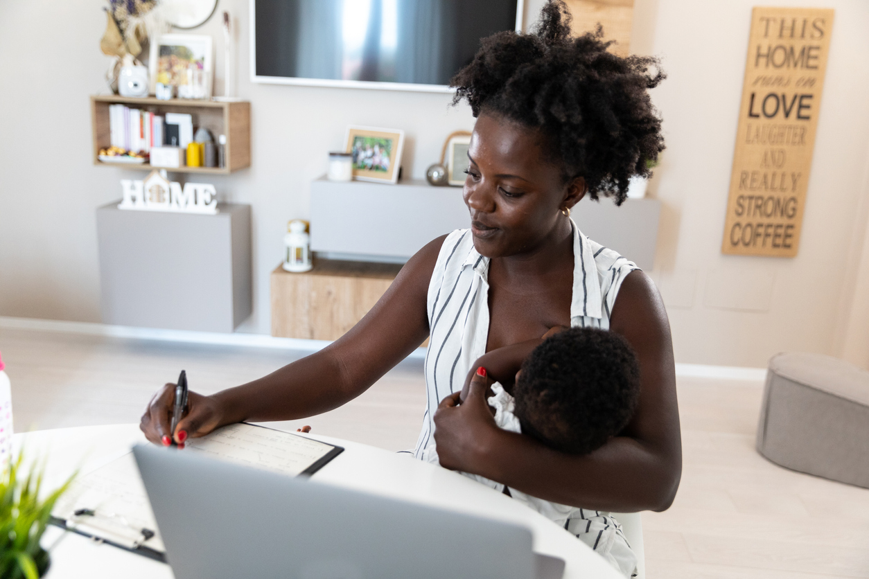 on computer with baby 