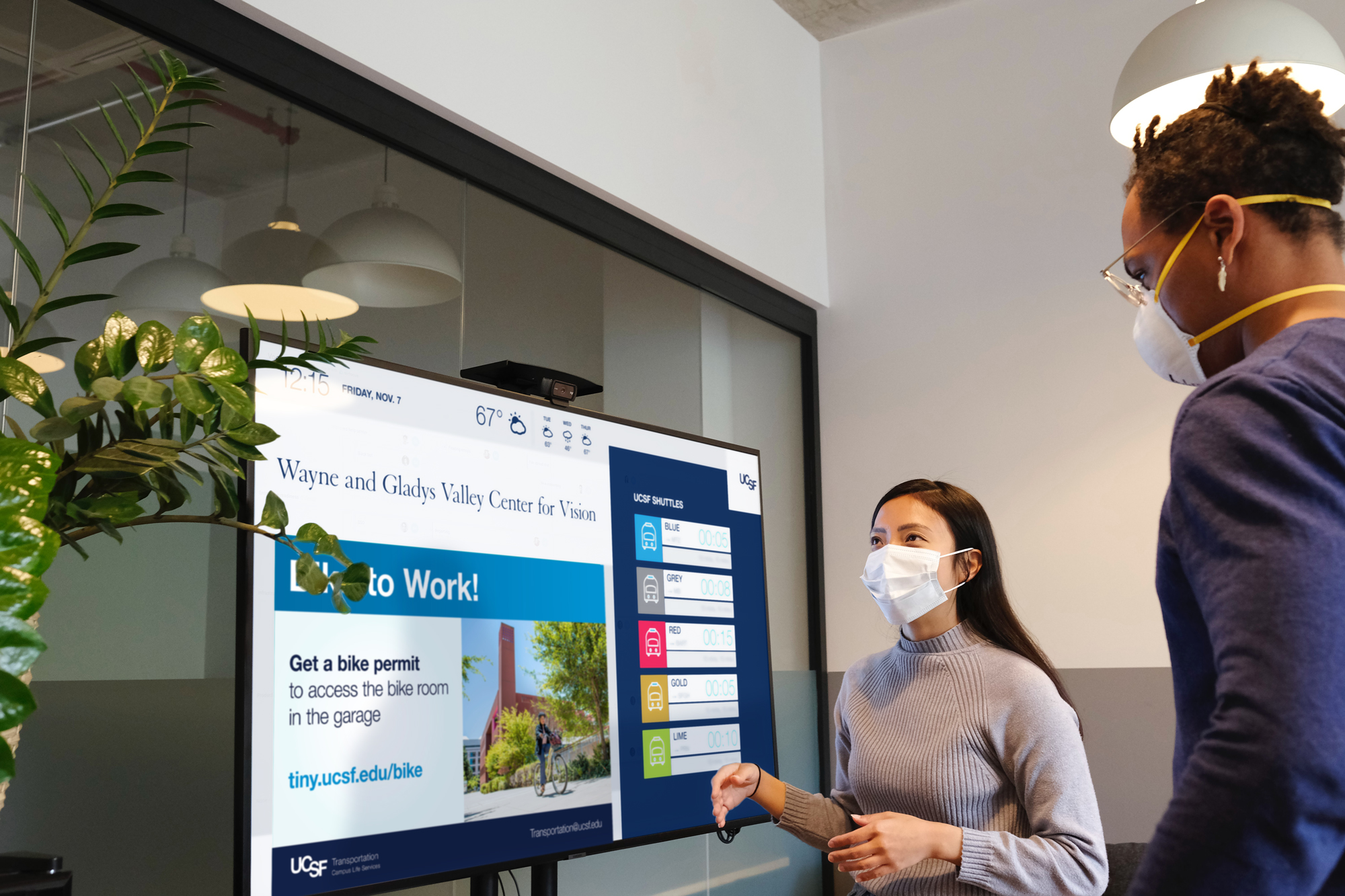 people looking at a digital ad