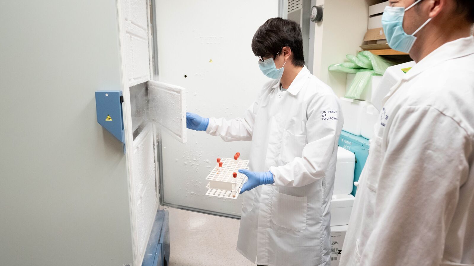 two people in front of a freezer