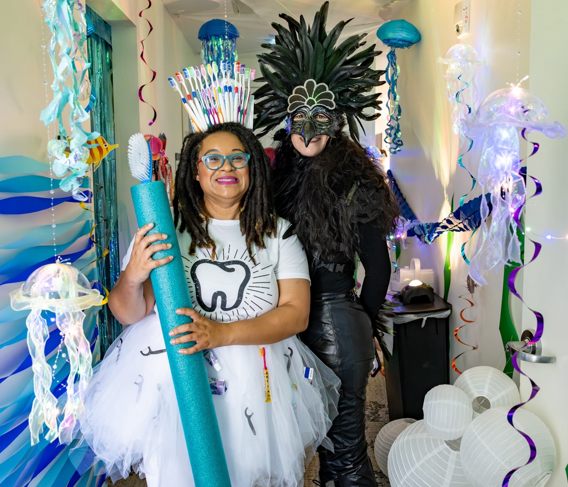 Costumed staff members welcome children at Under the Sea themed halloween event at Parnassus