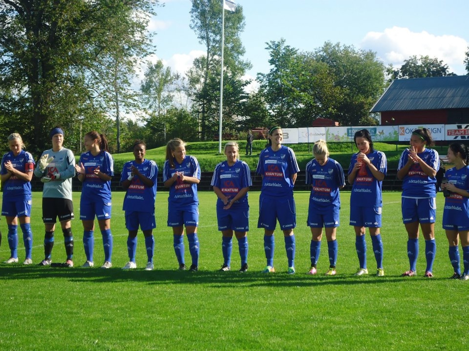 Jamie and team lined up in matching blue soccer uniforms