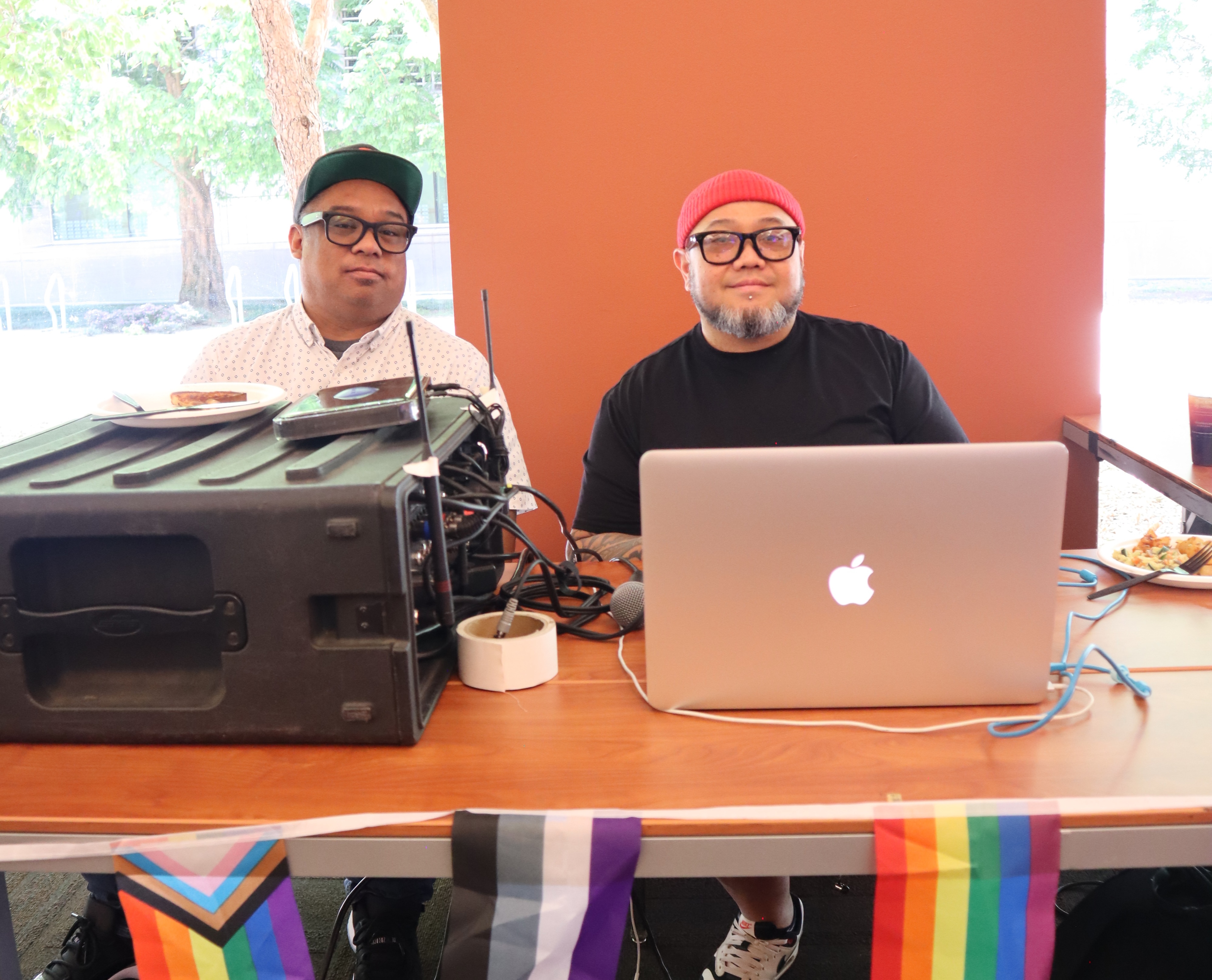 Two men behind DJ booth