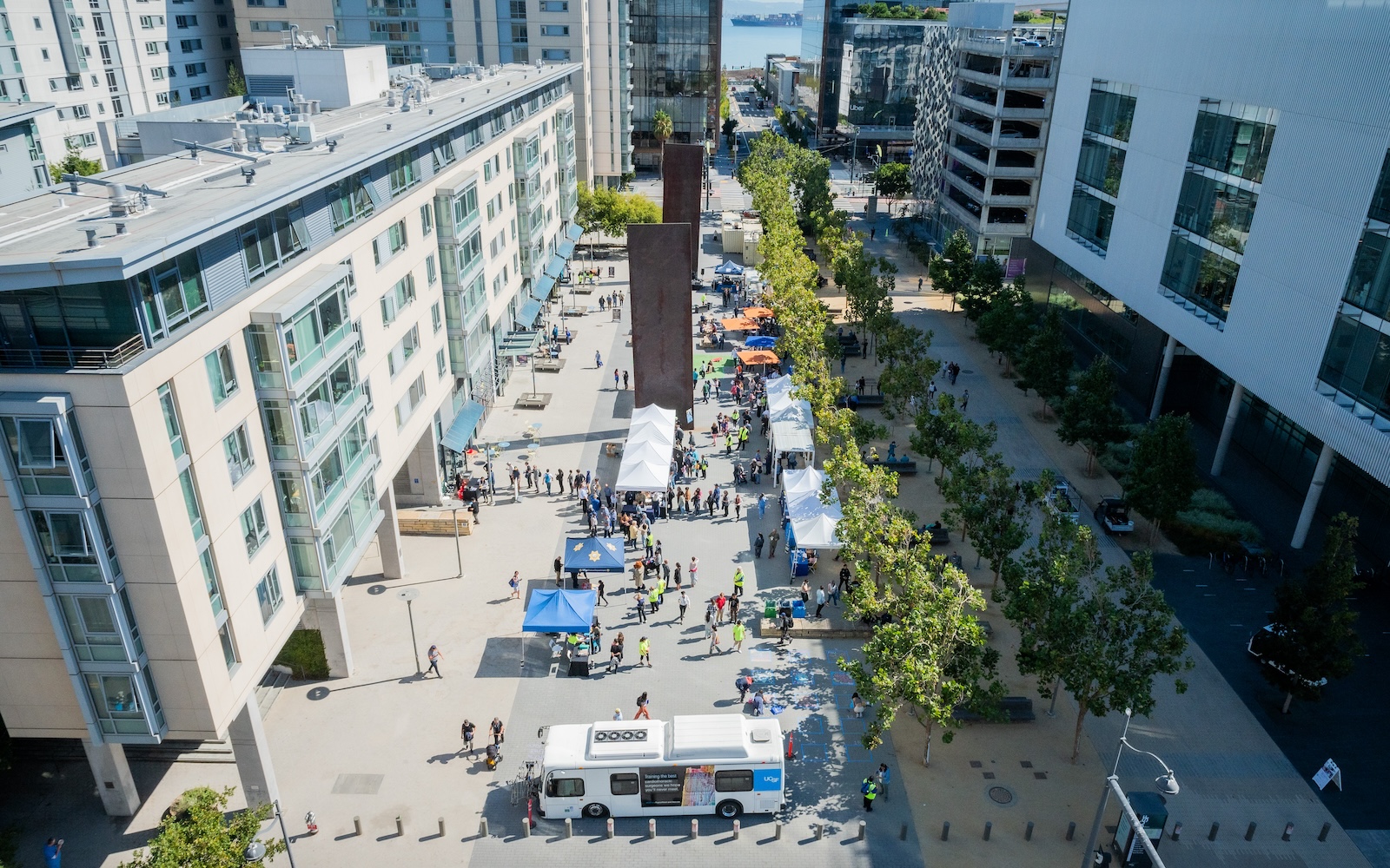 Photo shows UCSF shuttle and crowds from above at last year's Block Party