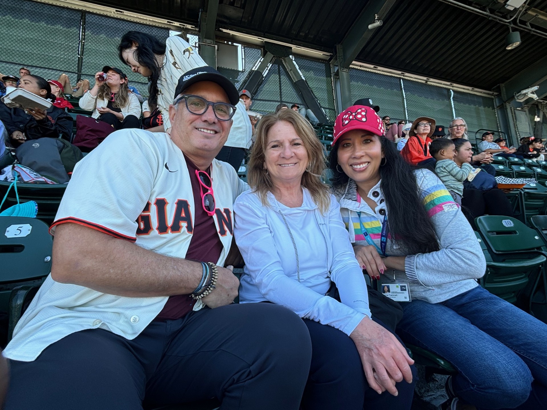 Jon, Kira, Joanna at a baseball game.