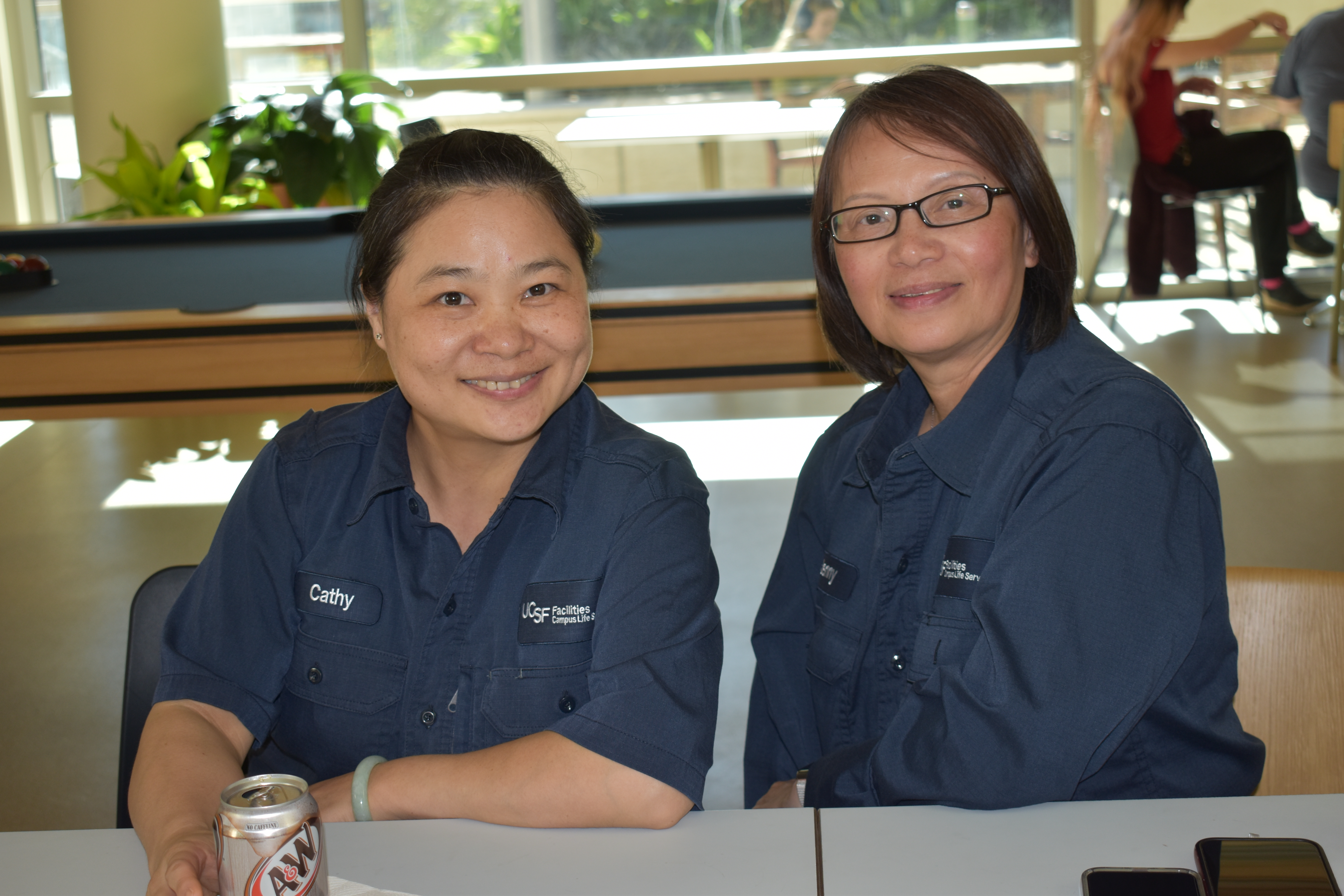 Facilities Staff Cathy Huang and Jenny Low enjoy beverages at the Building Connections event.