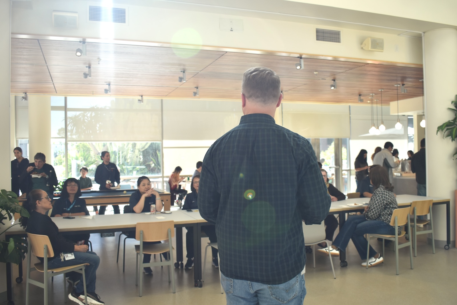 Facilities Manger Don Van Wie welcomes guests at Building Connections event