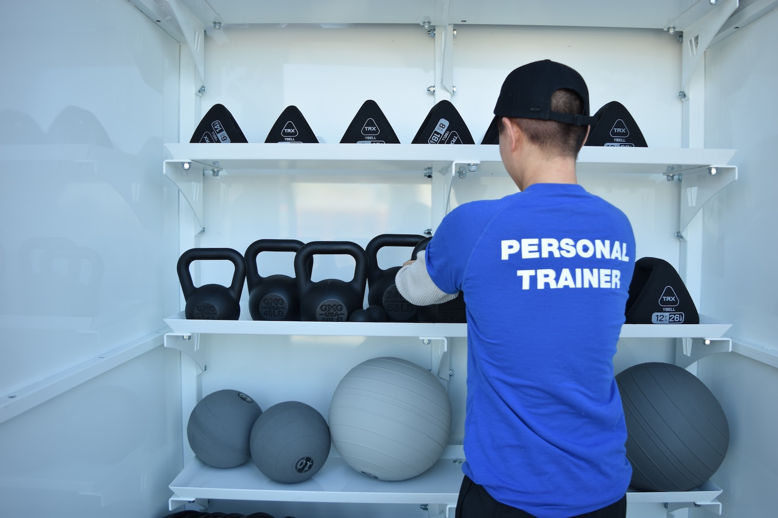 Personal Trainer, Lia Kilgore in the weights and equipment shed