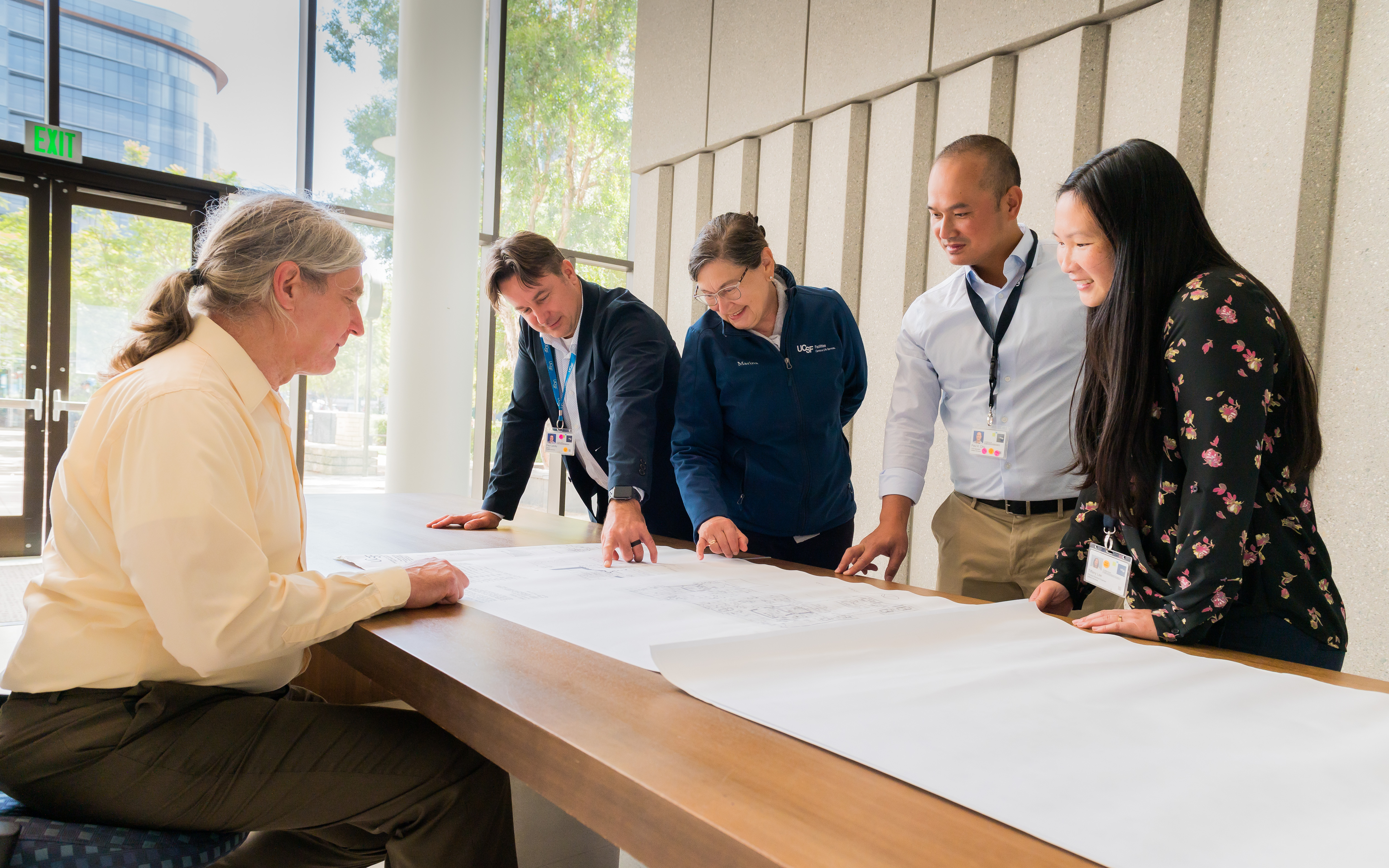 Engineers looking over plans.