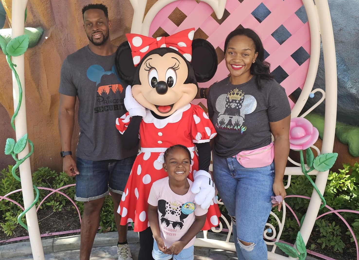 Photo of a family at Disneyland with Minnie Mouse