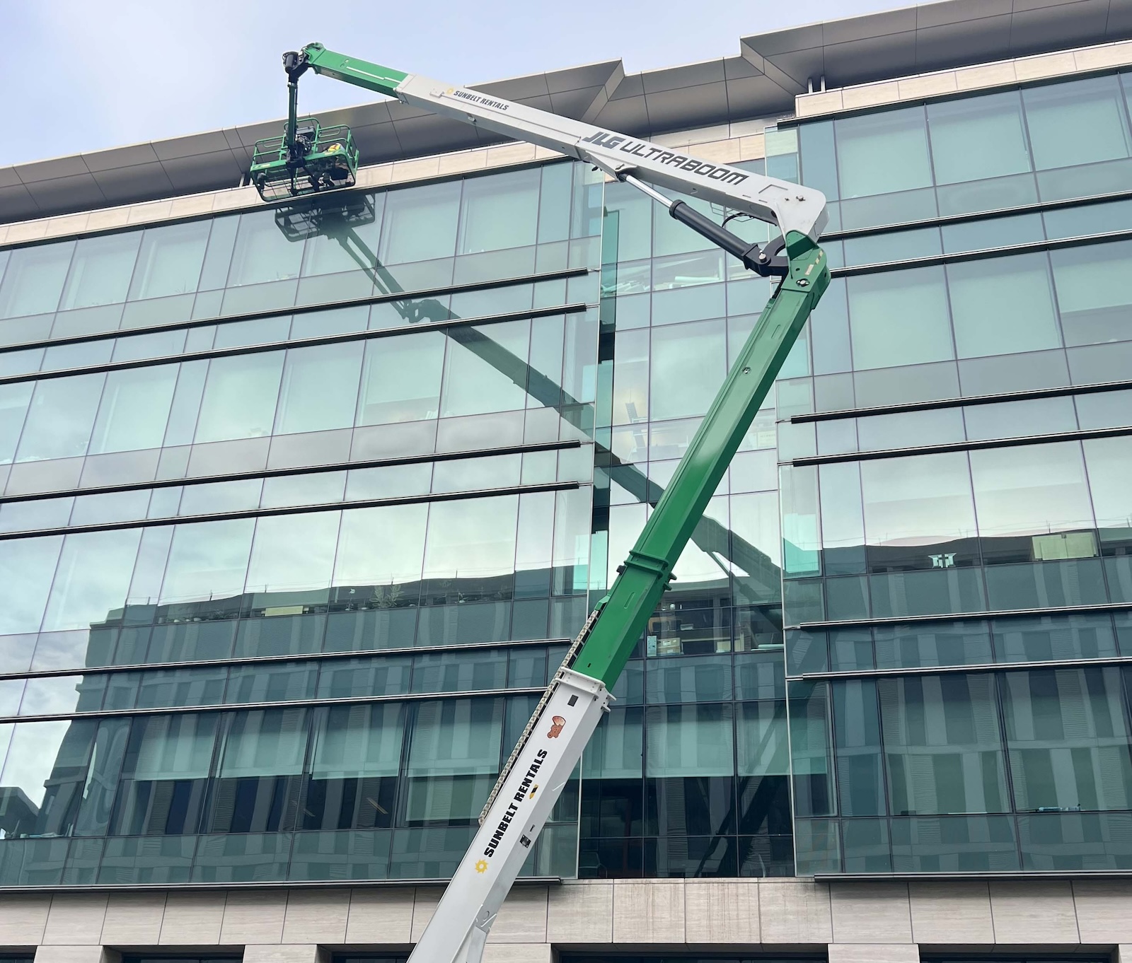 A spider lift reaches top floor of a building