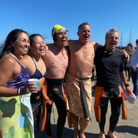 People hugging after the swim