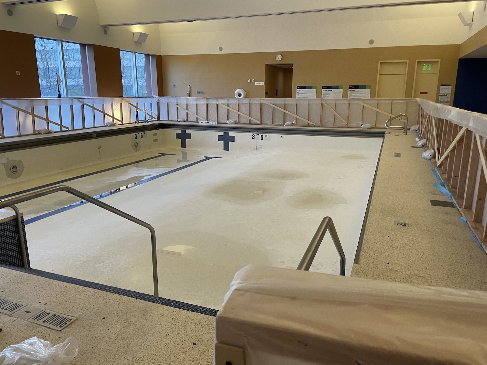 Empty pool with construction scaffolding