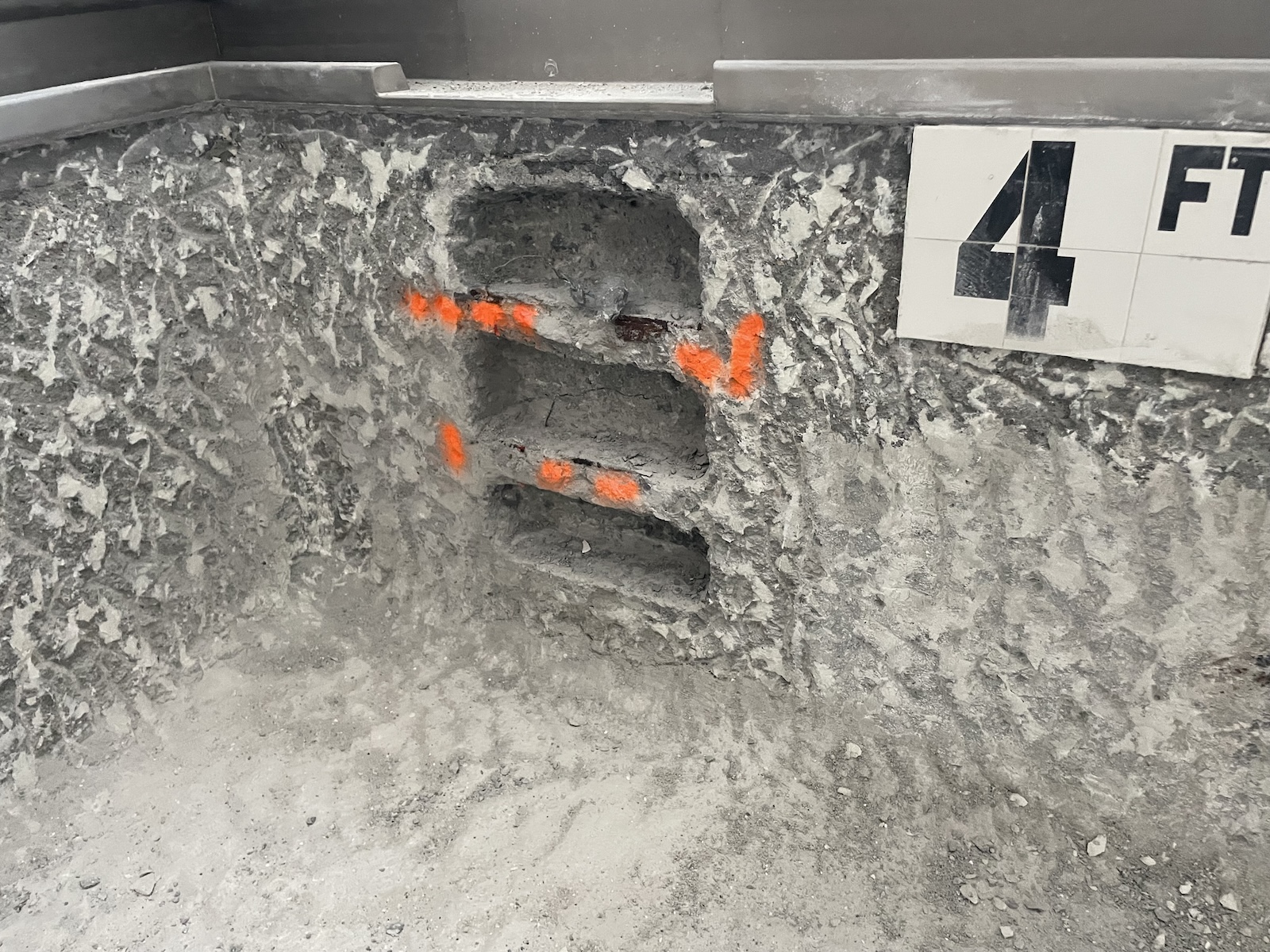 Facilities Services in the process of repairing the surface of the indoor pool at Bakar Fitness Center.