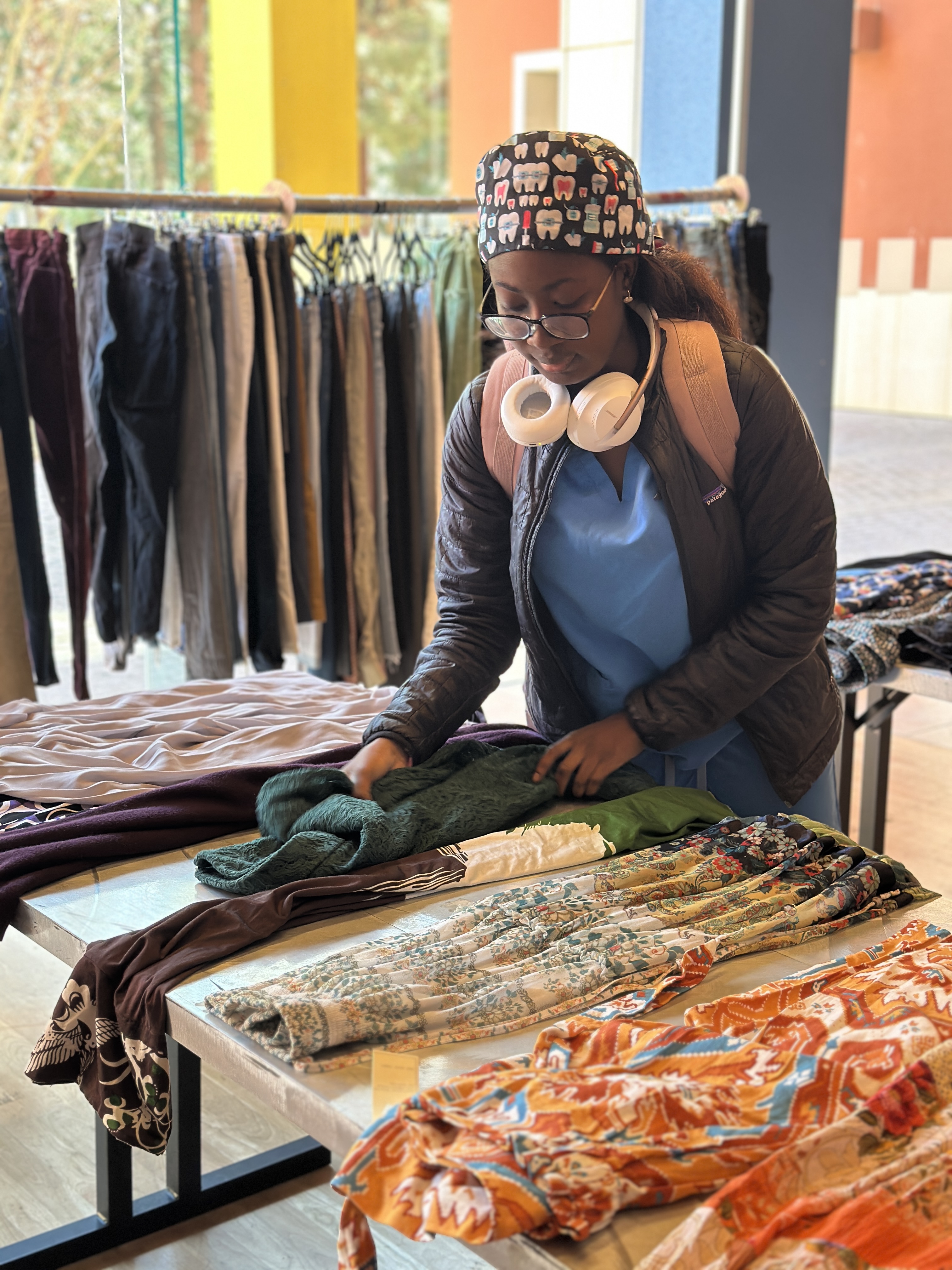 person looking at clothes