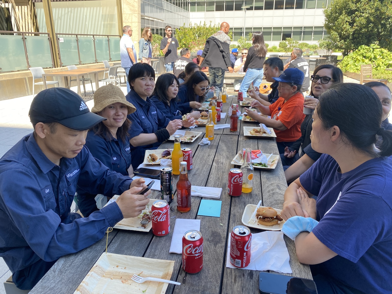 Staff celebrate with food and drinks