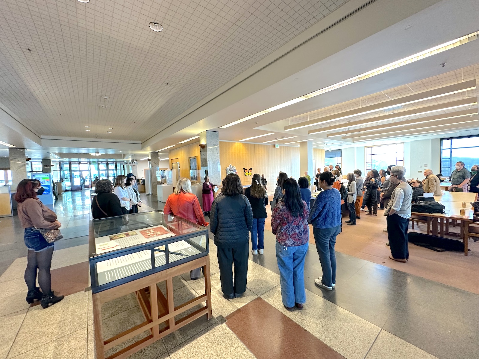 Tabancay presents to a crowd in the library.