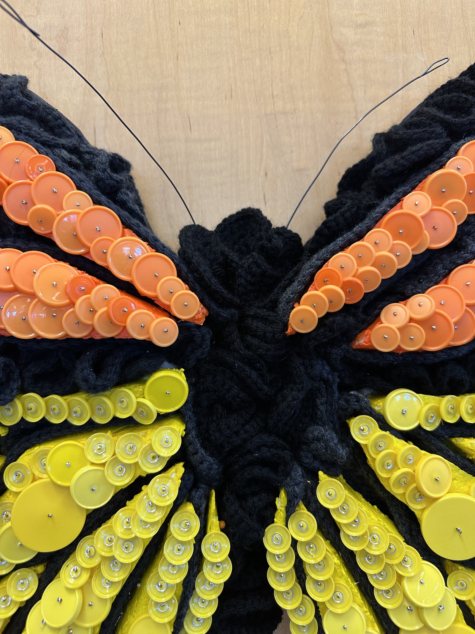 A butterfly made of repurposed lab materials