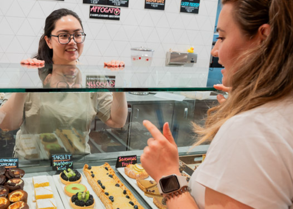 customer choosing which item they'd like at the service counter