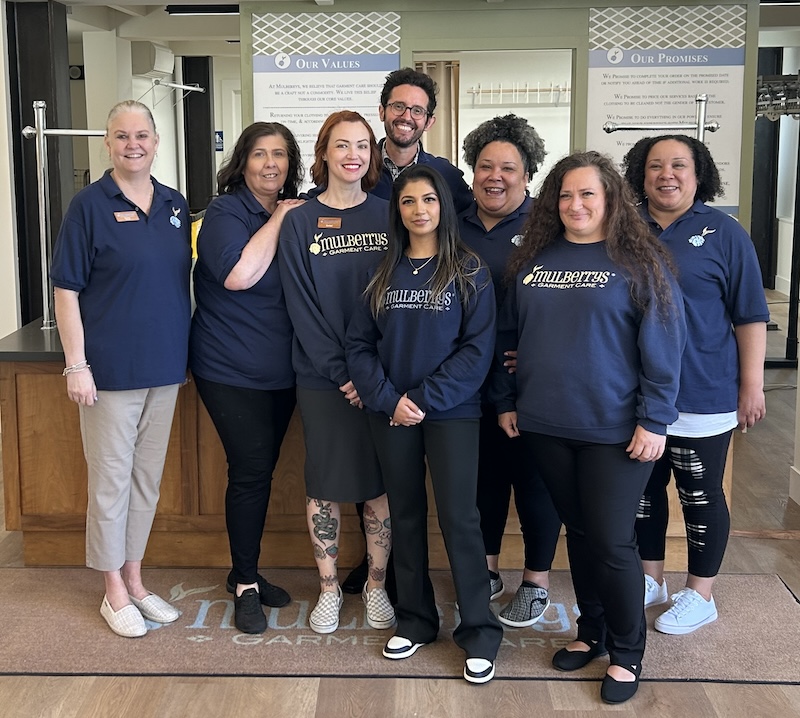 Multigenerational and multiethnic staff dressed in blue Mulberrys shirts at Mulberrys 1001 Stanyan location. 