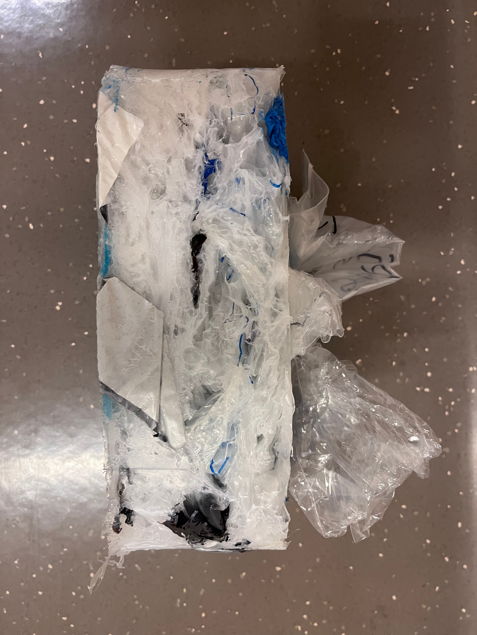 Plastic block after being heated and compressed in the compactor