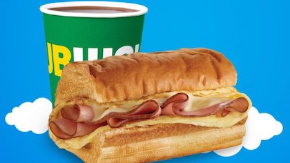Subway sandwich with a soda.