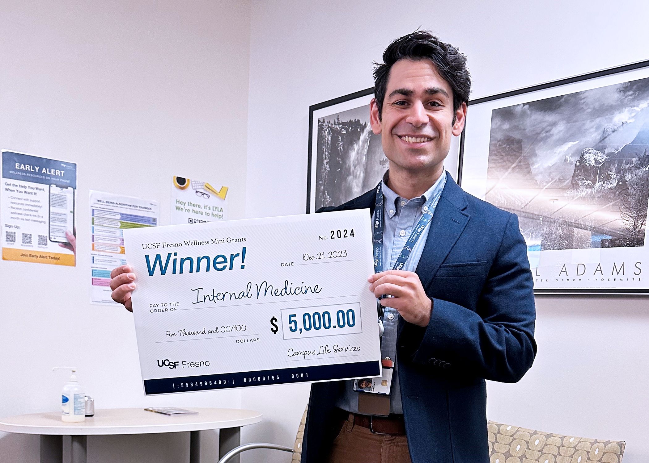 Man holding a large check.