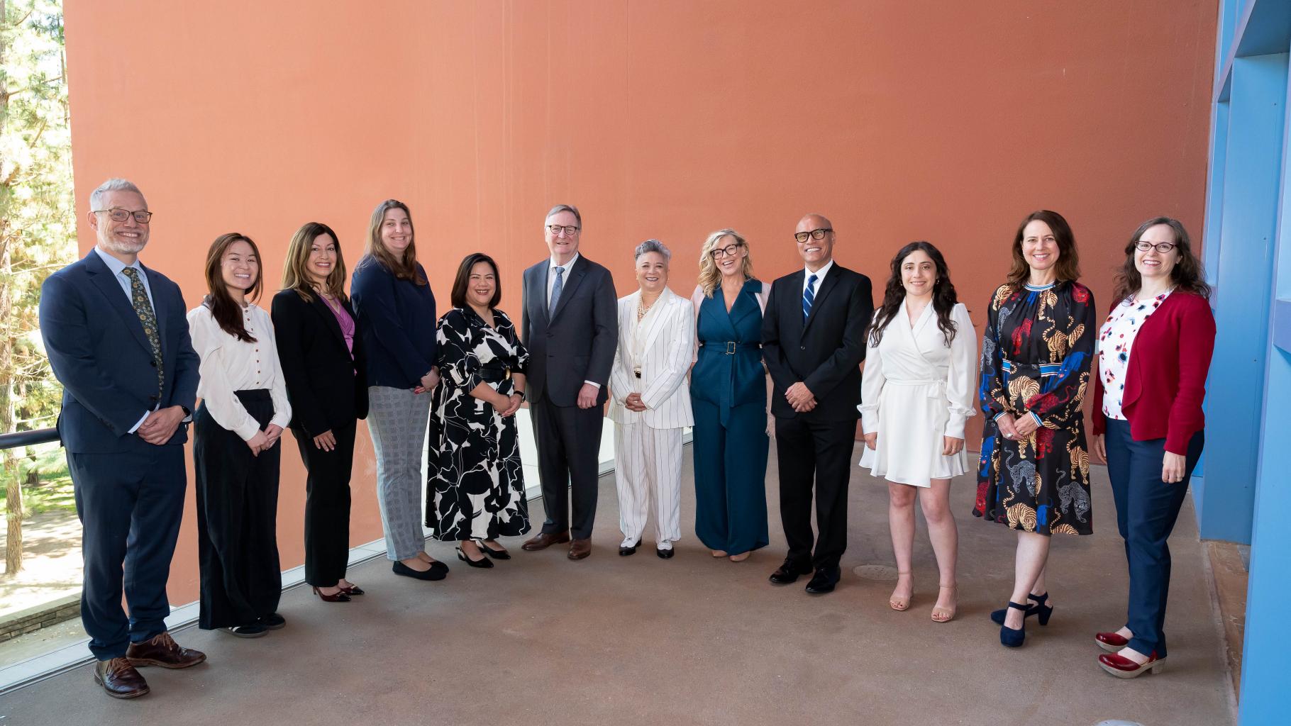 Mapa stands alongside Chancellor Sam Hawgood and the 2025 Founders Day Award Recipients