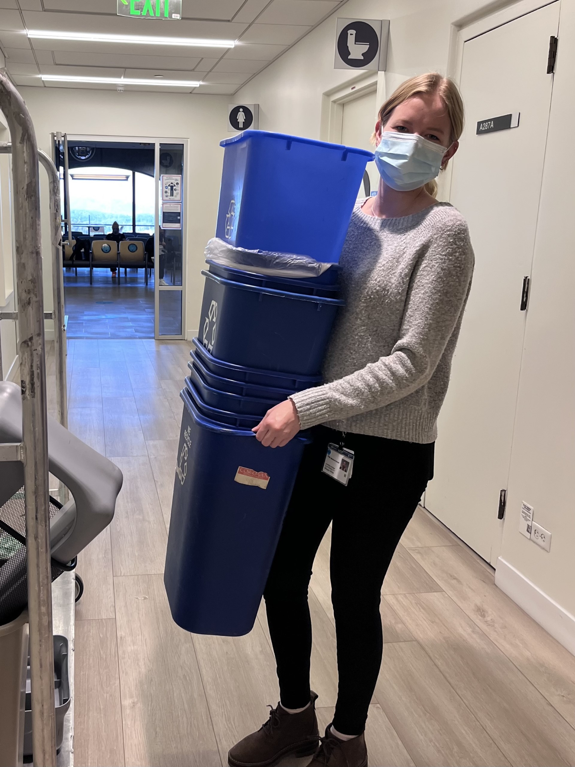 Person with recycling bins