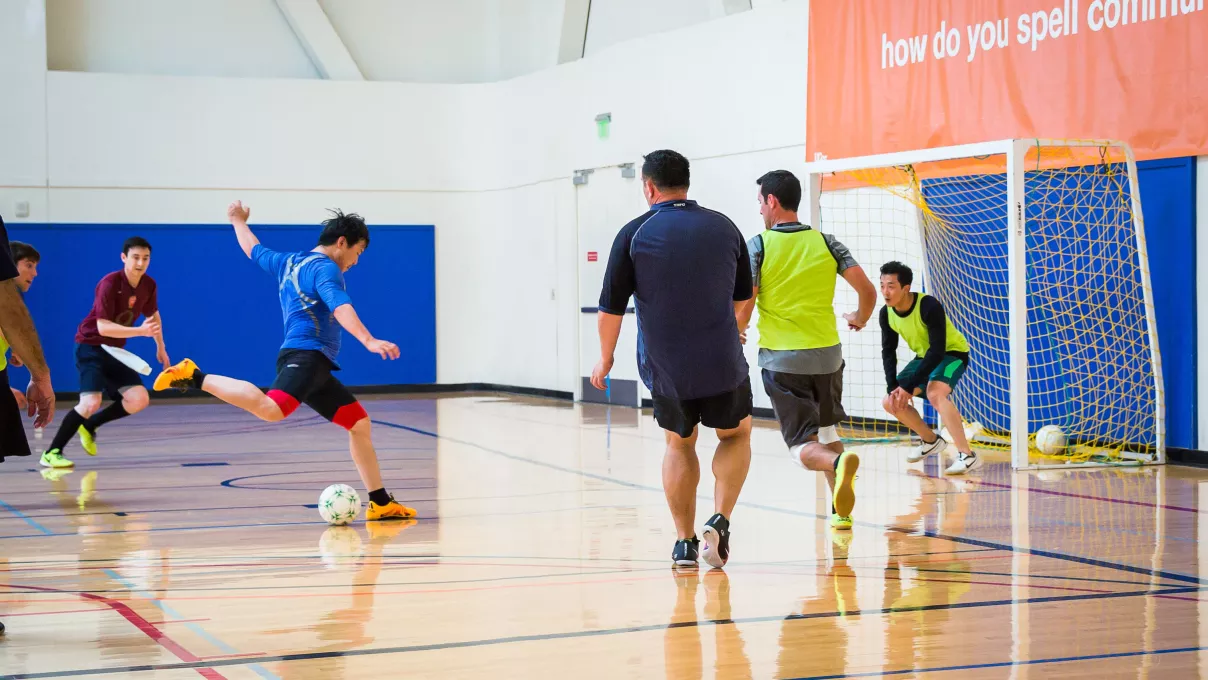 Playing indoor futsal in the gym